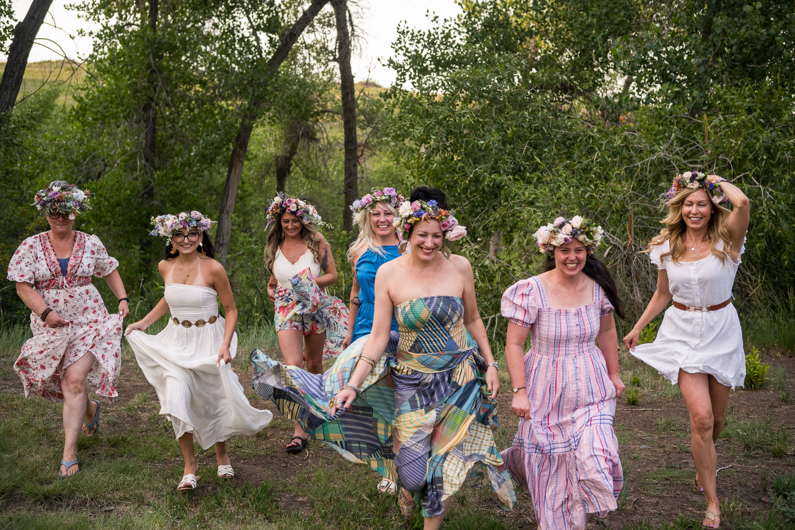 Women frolicking in flowing dresses and flower crowns
