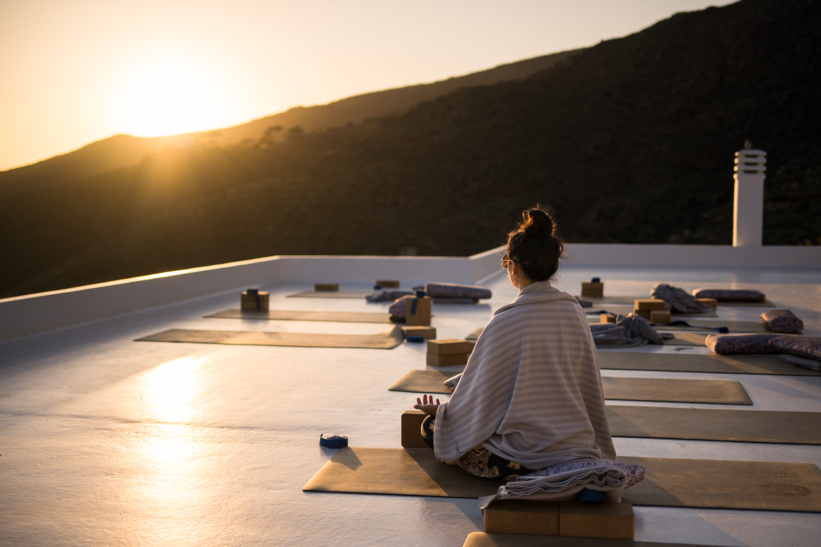 Woman in quiet meditation at sunrise
