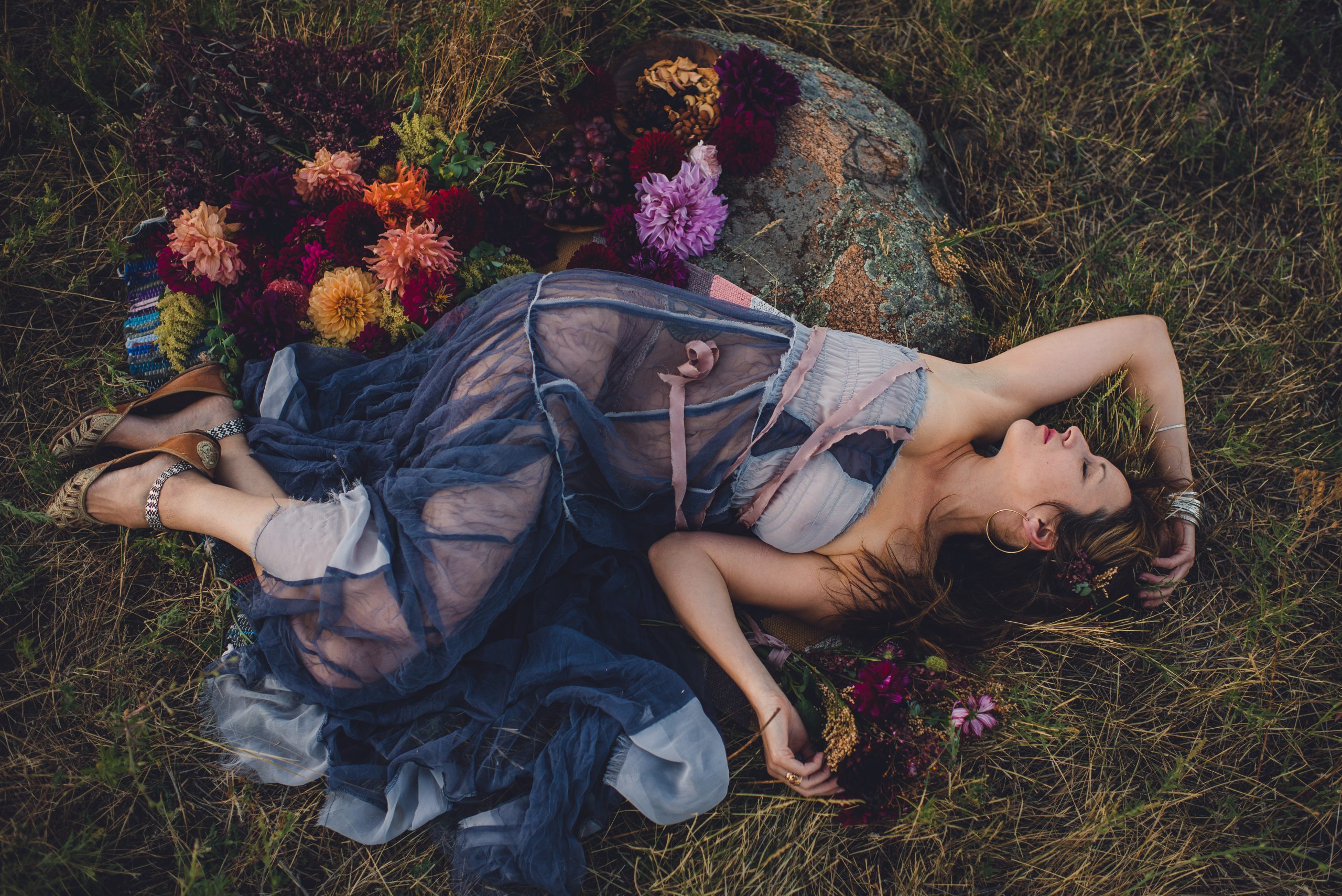 Woman resting among wildflowers in Boulder, Colorado